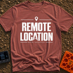 Working From Nowhere - T-Shirt in Brick - Text reading 'REMOTE LOCATION' in large black letters with the 'A' stylized as...