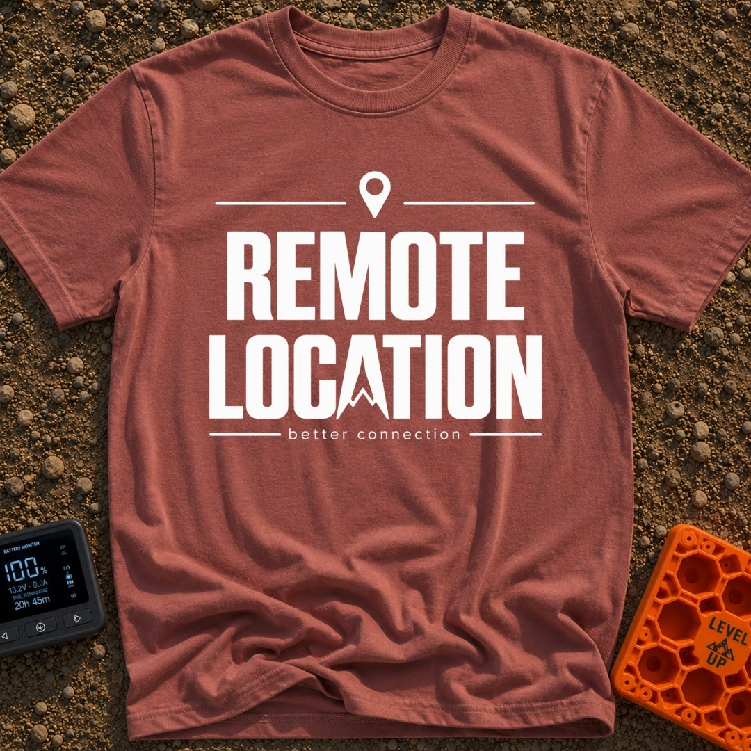 Working From Nowhere - T-Shirt in Brick - Text reading 'REMOTE LOCATION' in large black letters with the 'A' stylized as...