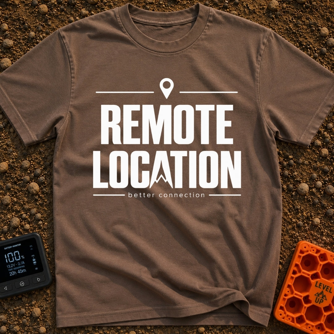 Working From Nowhere - T-Shirt in Espresso - Text reading 'REMOTE LOCATION' in large black letters with the 'A' stylized...