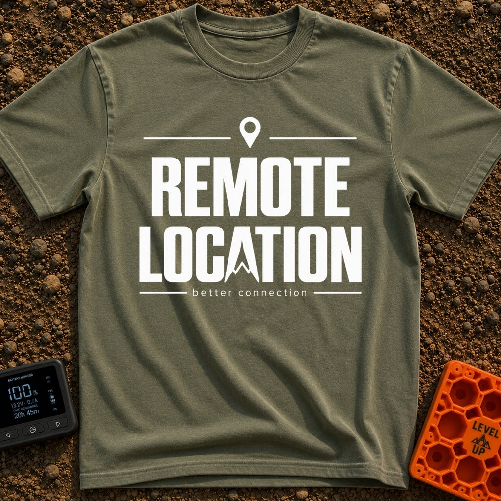 Working From Nowhere - T-Shirt in Moss - Text reading 'REMOTE LOCATION' in large black letters with the 'A' stylized as a...