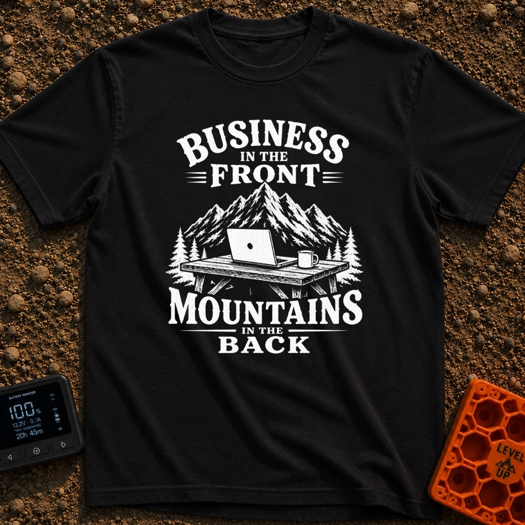 Working From Roam - T-Shirt in Black - A black and white illustration of an open laptop and a mug sitting on a wooden...