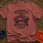 Working From Roam - T-Shirt in Brick - A black and white illustration of an open laptop and a mug sitting on a wooden...