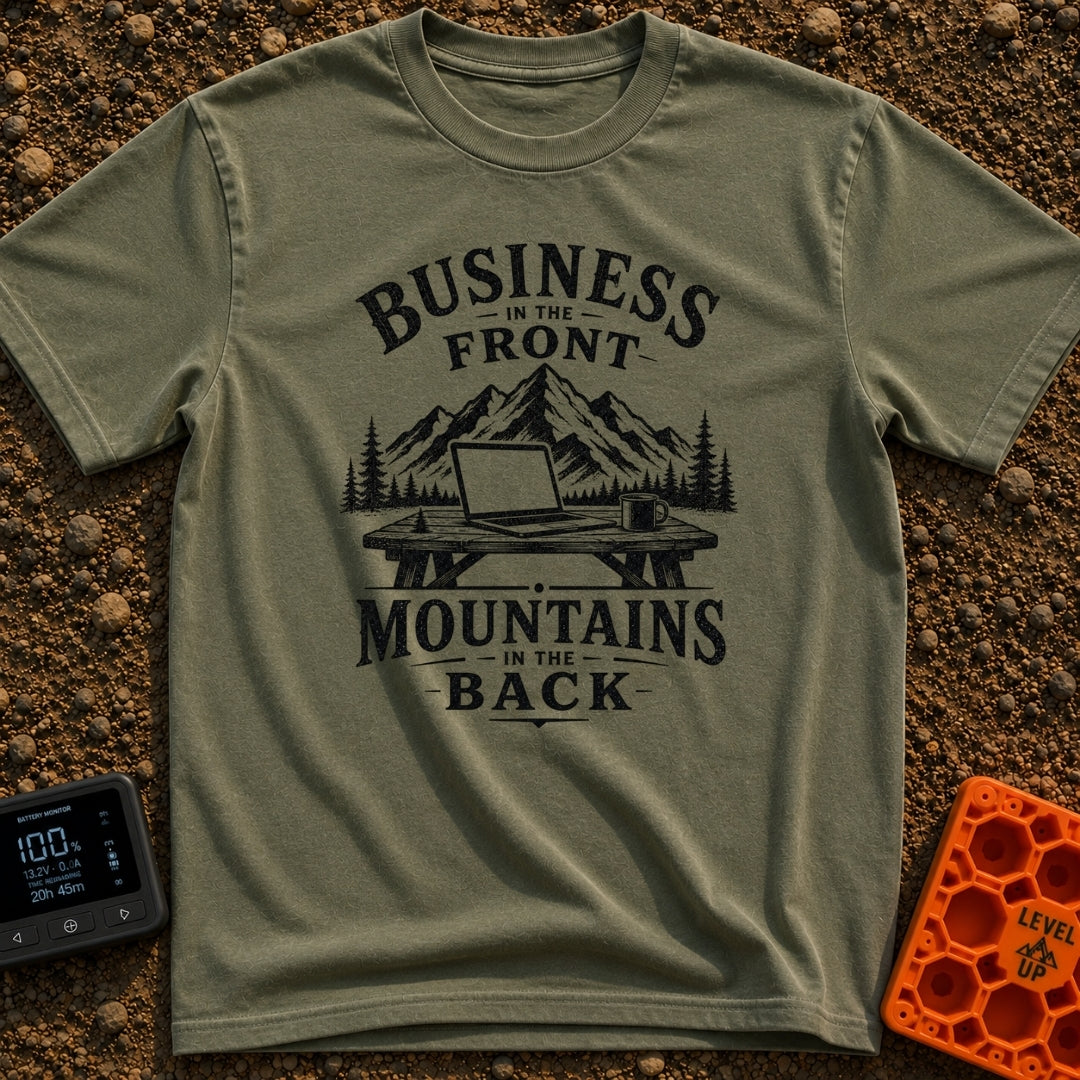 Working From Roam - T-Shirt in Moss - A black and white illustration of an open laptop and a mug sitting on a wooden...