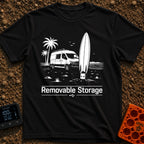External Surf Drive - T-Shirt in Black - A black and white illustration of a camper van parked on a beach with palm trees...