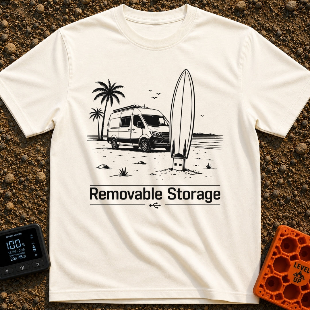 External Surf Drive - T-Shirt in Ivory - A black and white illustration of a camper van parked on a beach with palm trees...