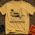 External Surf Drive - T-Shirt in Mustard - A black and white illustration of a camper van parked on a beach with palm...