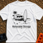 External Surf Drive - T-Shirt in White - A black and white illustration of a camper van parked on a beach with palm trees...