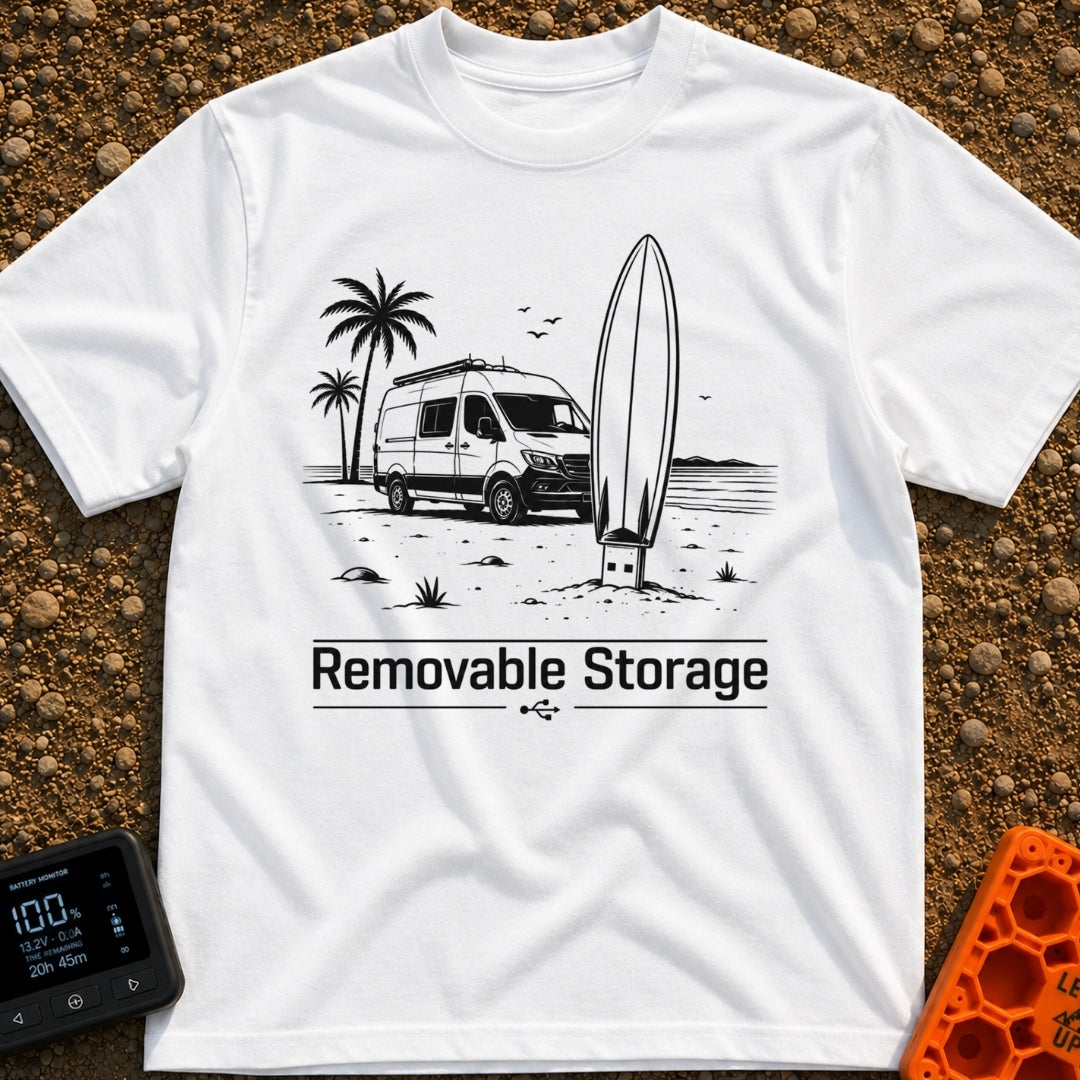 External Surf Drive - T-Shirt in White - A black and white illustration of a camper van parked on a beach with palm trees...
