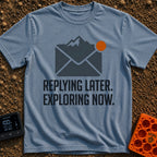 Reply Later Explore Now - T-Shirt in Blue Jean - A graphic of a dark grey email envelope where the top flap is shaped...