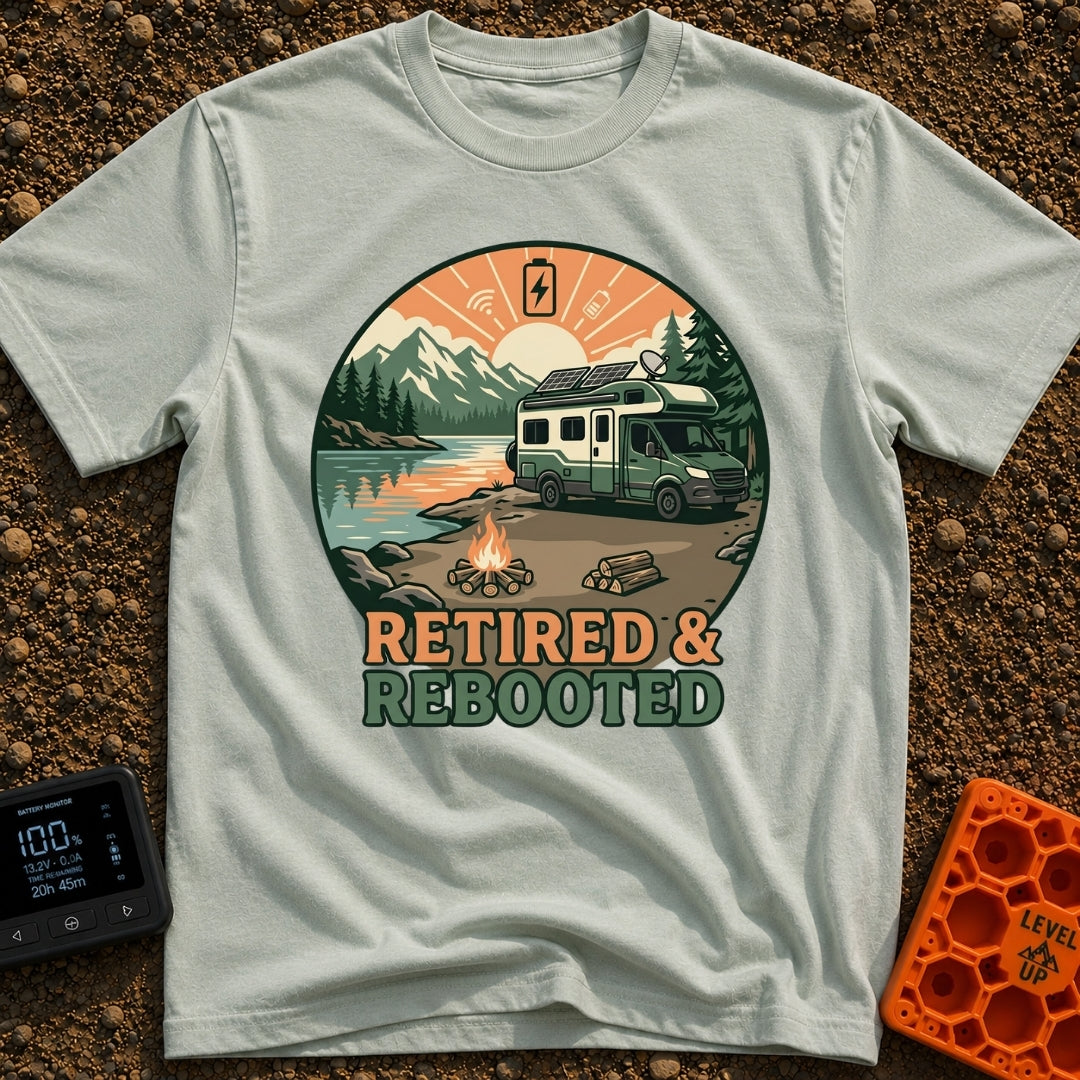 Retired and Rebooted - T-Shirt in Bay - A circular illustration of a green and white RV parked beside a mountain lake...