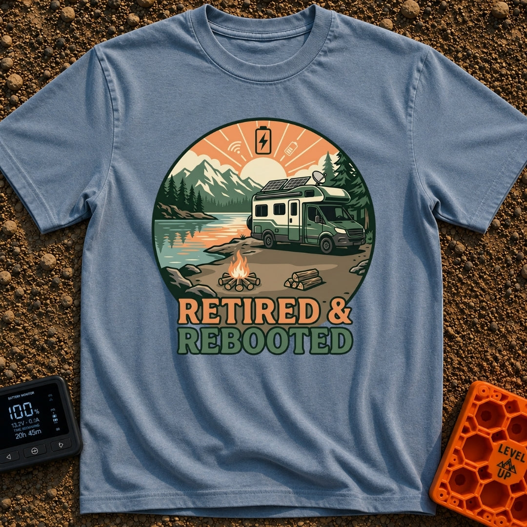 Retired and Rebooted - T-Shirt in Blue Jean - A circular illustration of a green and white RV parked beside a mountain...