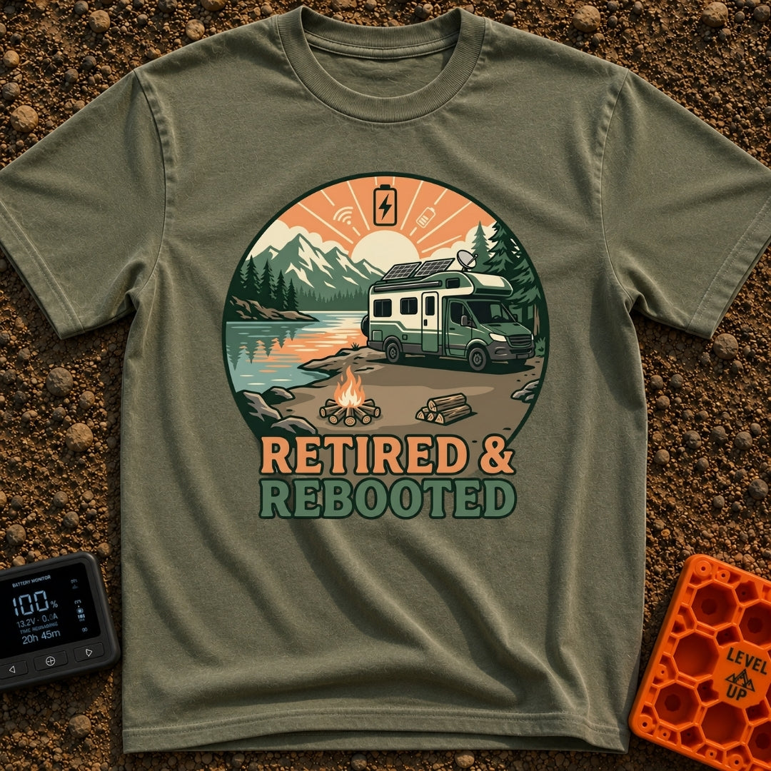 Retired and Rebooted - T-Shirt in Moss - A circular illustration of a green and white RV parked beside a mountain lake...