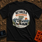 Recharged on Wheels - T-Shirt in Black - A circular badge illustration of a white camper van with a roof solar panel and...