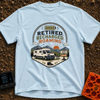 Retired But Recharged - T-Shirt in Chambray - A graphic badge depicting a white campervan parked in a mountainous...