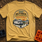 Retired But Recharged - T-Shirt in Mustard - A graphic badge depicting a white campervan parked in a mountainous...