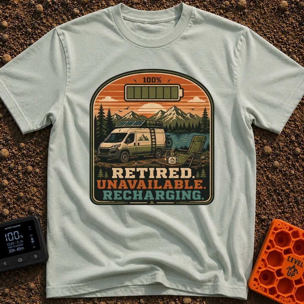 Retired And Recharging - T-Shirt in Bay - A camper van equipped with roof-mounted solar panels is parked at a scenic...