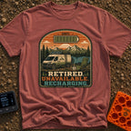 Retired And Recharging - T-Shirt in Brick - A camper van equipped with roof-mounted solar panels is parked at a scenic...