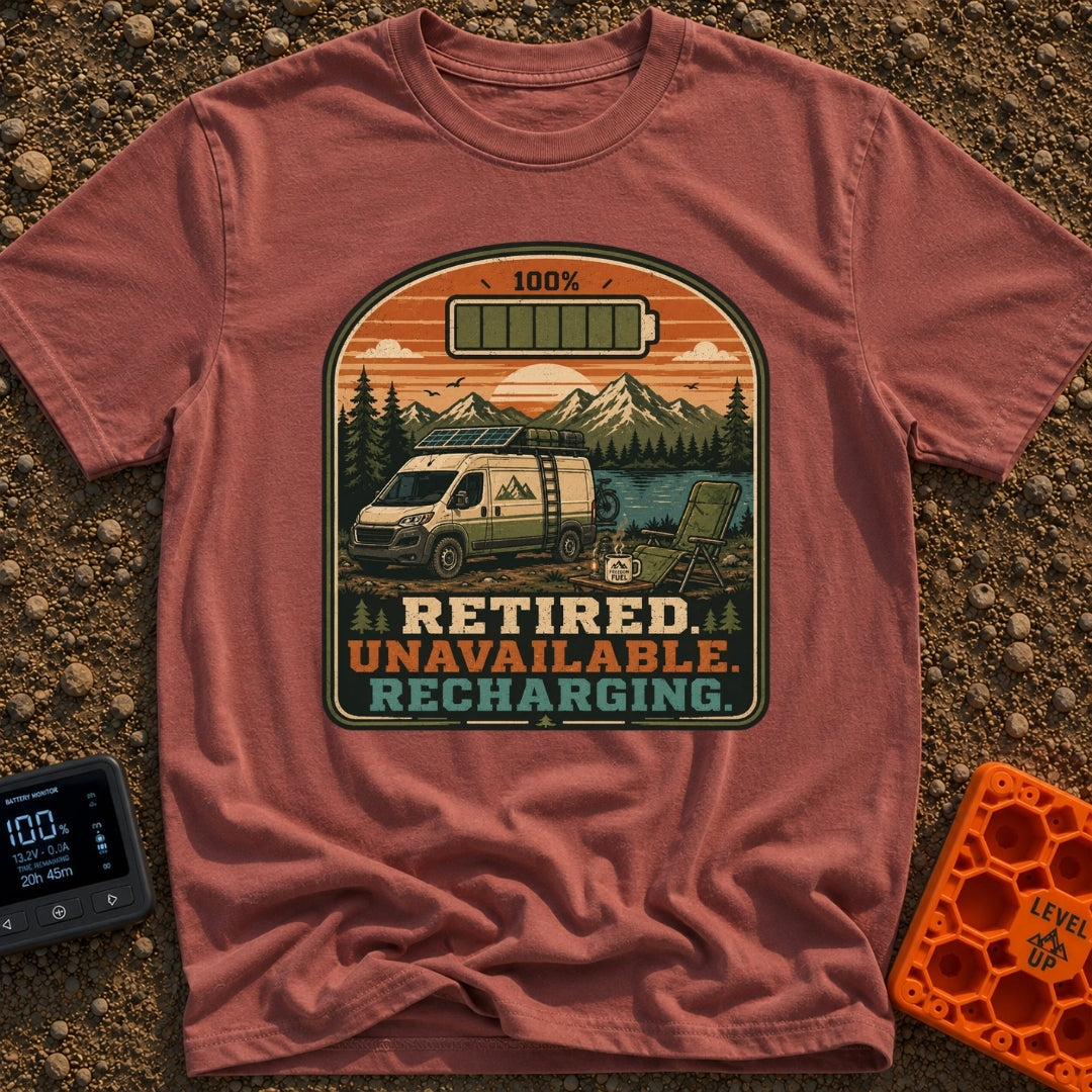 Retired And Recharging - T-Shirt in Brick - A camper van equipped with roof-mounted solar panels is parked at a scenic...