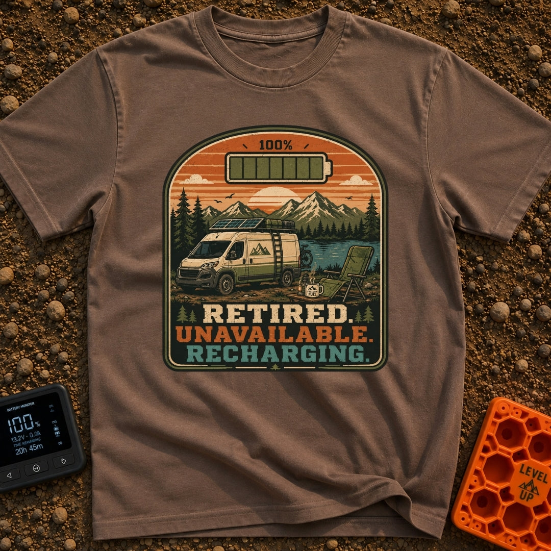 Retired And Recharging - T-Shirt in Espresso - A camper van equipped with roof-mounted solar panels is parked at a scenic...