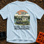Retired And Recharging - T-Shirt in Chambray - A green Class C camper van with rooftop solar panels is parked by a lake...