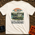 Retired And Recharging - T-Shirt in Ivory - A green Class C camper van with rooftop solar panels is parked by a lake and...