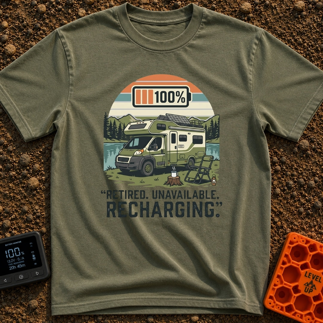 Retired And Recharging - T-Shirt in Moss - A green Class C camper van with rooftop solar panels is parked by a lake and...