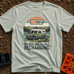 Retired And Recharging - T-Shirt in Bay - A green and white camper van with roof-mounted solar panels is parked beside a...