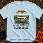 Retired And Recharging - T-Shirt in Chambray - A green and white camper van with roof-mounted solar panels is parked...
