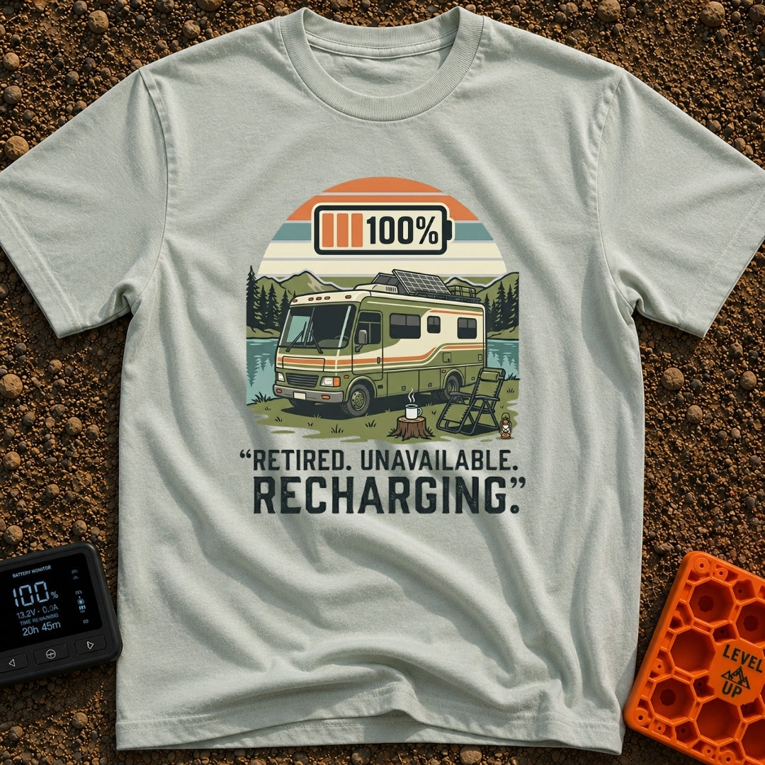 Recharging In Progress - T-Shirt in Bay - An illustration of a green and white motorhome parked by a lake with mountains...