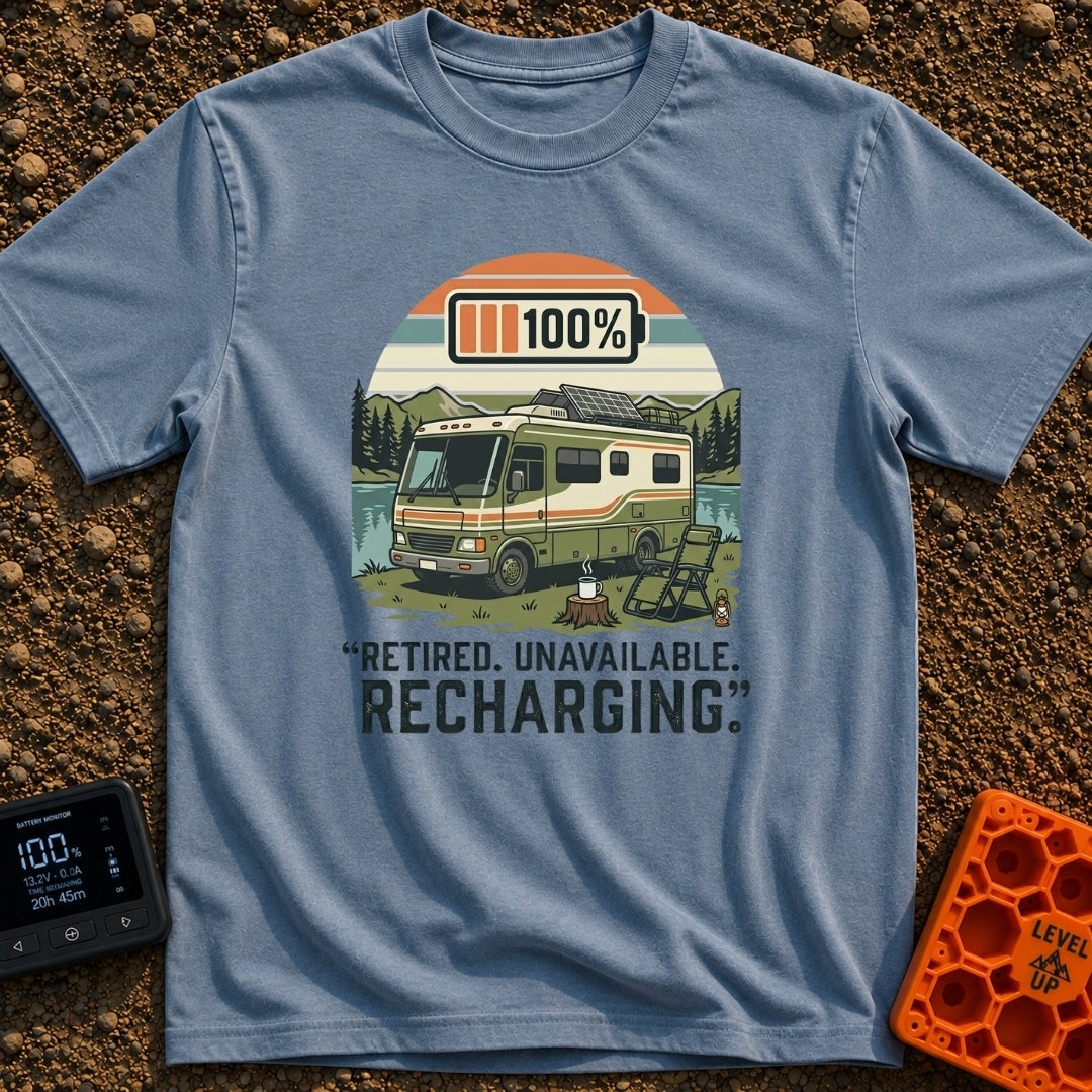 Recharging In Progress - T-Shirt in Blue Jean - An illustration of a green and white motorhome parked by a lake with...