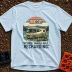 Recharging In Progress - T-Shirt in Chambray - An illustration of a green and white motorhome parked by a lake with...