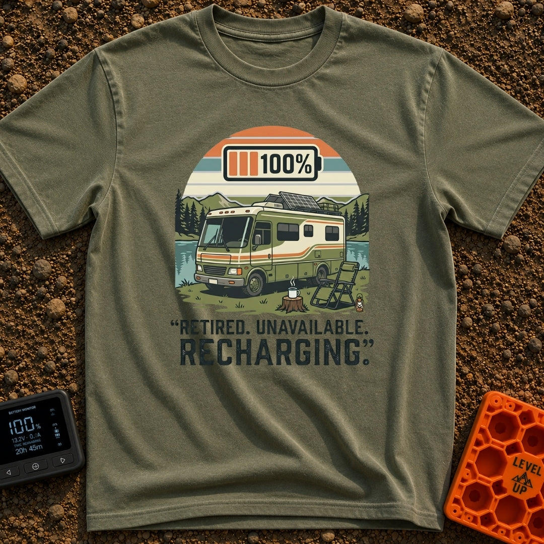 Recharging In Progress - T-Shirt in Moss - An illustration of a green and white motorhome parked by a lake with mountains...