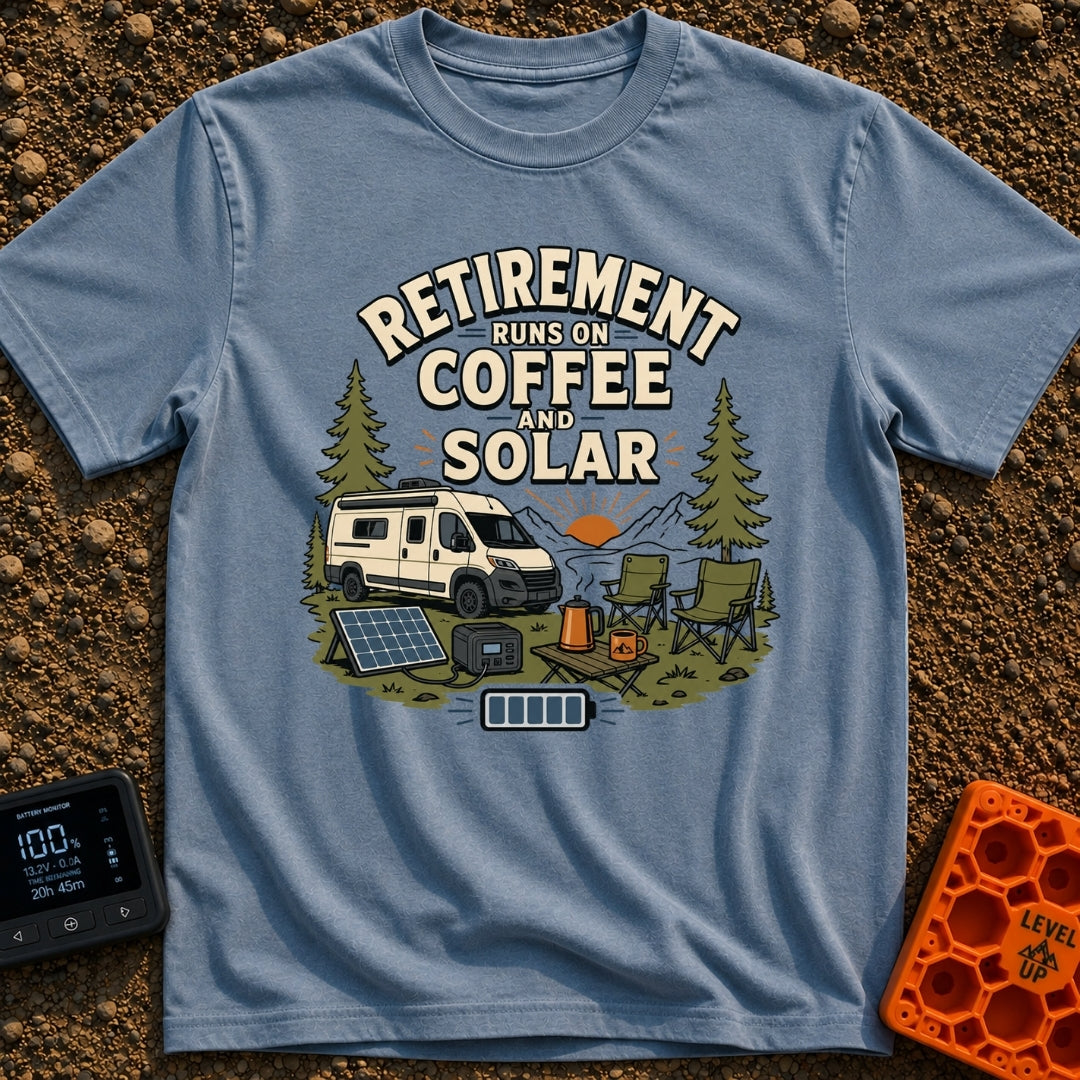 Solar Powered Retirement - T-Shirt in Blue Jean - An illustration of a camper van parked in a mountainous, forested...