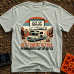 Permanently Out Of Office - T-Shirt in Bay - A vintage-style motorhome is parked in a red rock desert canyon with solar...