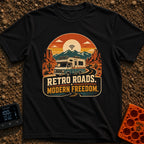 Wired In The Wild - T-Shirt in Black - A retro-style motorhome with a large solar panel on its roof drives along a...