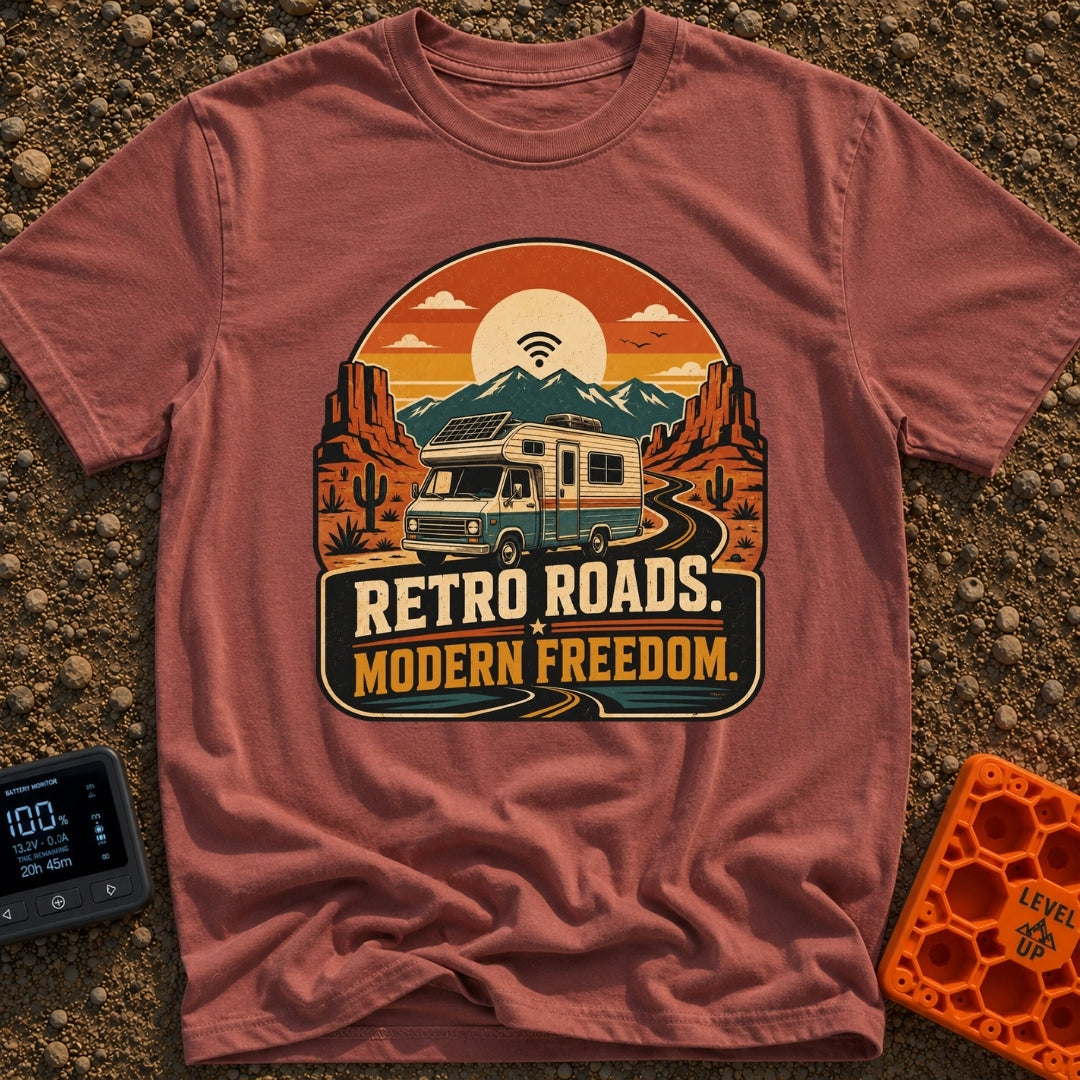 Wired In The Wild - T-Shirt in Brick - A retro-style motorhome with a large solar panel on its roof drives along a...