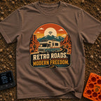 Wired In The Wild - T-Shirt in Espresso - A retro-style motorhome with a large solar panel on its roof drives along a...