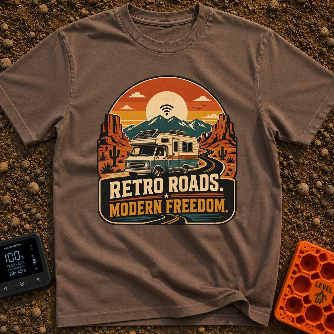Wired In The Wild - T-Shirt in Espresso - A retro-style motorhome with a large solar panel on its roof drives along a...
