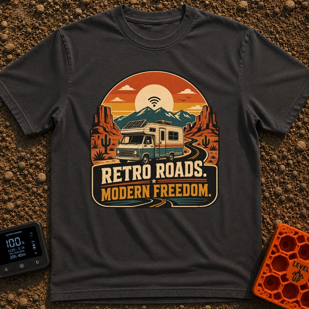Wired In The Wild - T-Shirt in Graphite - A retro-style motorhome with a large solar panel on its roof drives along a...