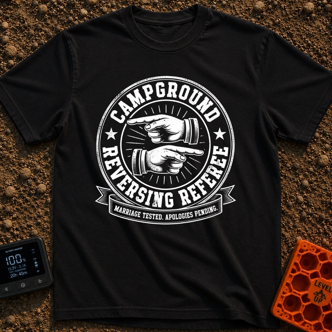 The Reversing Referee - T-Shirt in Black - A circular, vintage-style badge graphic reading "CAMPGROUND" and "REVERSING...