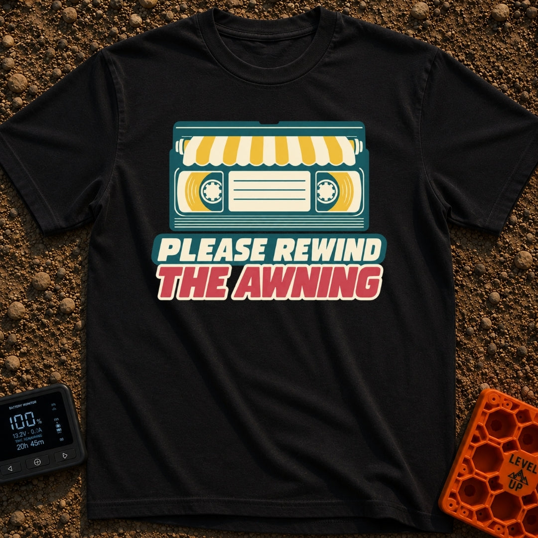 Be Kind Rewind Awning - T-Shirt in Black - A retro illustration of a VHS cassette tape with a yellow and white striped...