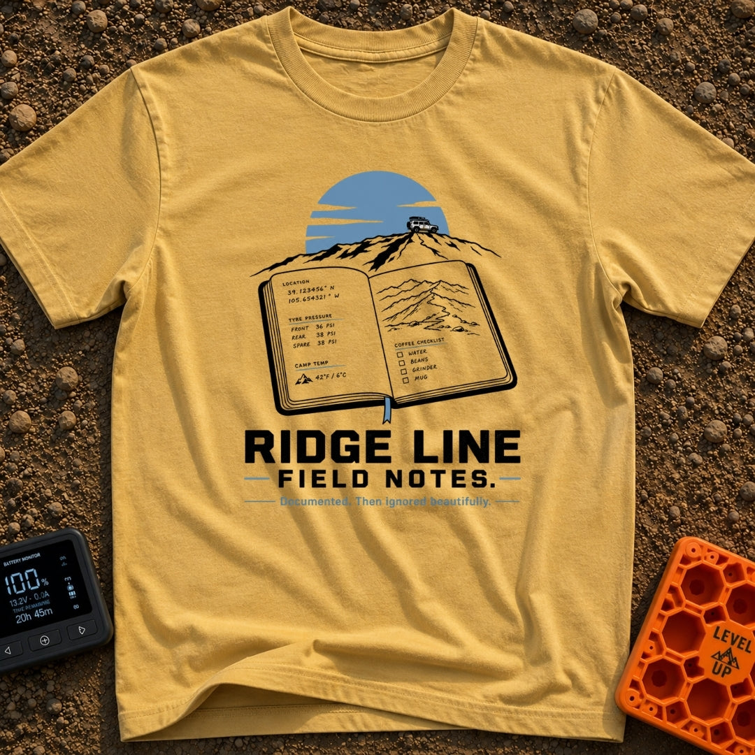 Ridge Top Chronicles - T-Shirt in Mustard - An open notebook showing GPS coordinates, tyre pressure logs, a mountain...