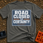 No Certainty Ahead - T-Shirt in Pepper - A graphic designed to look like a blue highway sign with white text that reads...