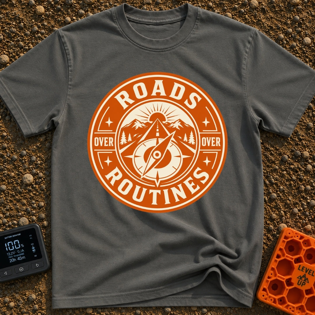 Roads Over Routines - T-Shirt in Pepper - A circular, orange and cream badge design featuring a straight highway leading...