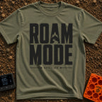 Stuck In Roam Mode - T-Shirt in Moss - Large, bold black text spelling out "ROAM MODE" stacked on two lines, with the...
