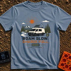 Slow Down Charge Up - T-Shirt in Blue Jean - A white camper van with a tilted roof-mounted solar panel and satellite dish...