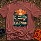 Off Grid Online - T-Shirt in Brick - A graphic illustration of a camper van parked on a beach at sunset with a prominent...