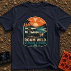 Off Grid Online - T-Shirt in Navy - A graphic illustration of a camper van parked on a beach at sunset with a prominent...