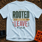 Rooted Yet Roaming - T-Shirt in Chambray - A typographic design reading "ROOTED ENOUGH TO LEAVE" with roots drawn inside...