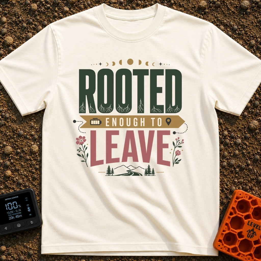 Rooted Yet Roaming - T-Shirt in Ivory - A typographic design reading "ROOTED ENOUGH TO LEAVE" with roots drawn inside the...